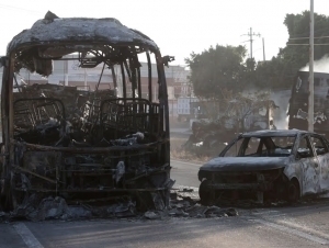 Мексикада тартибсизликлар авж олди. 18 киши ҳалок бўлди (фоторепортаж)