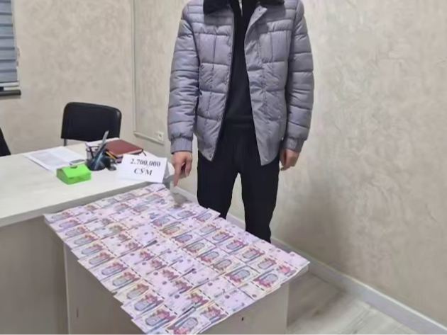 Andijonda IIO xodimi va universitet menejeri pora bilan ushlandi (video)