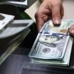 Official dollar exchange rate drops by 6.64 sums in Uzbekistan