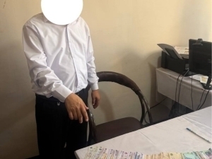 Ер олиб бериш эвазига пора олган Савдо-саноат палатаси мансабдори ушланди