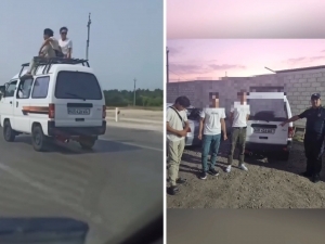 Two young men climb onto the roof of a moving Damas car in Bukhara(video)