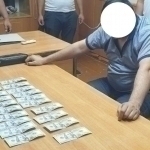 Нукусда олийгоҳ директори ўринбосари пора билан қўлга тушди