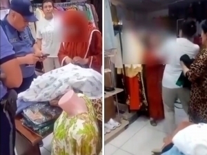 Woman faced vigilante justice for stealing clothes from a store in Namangan