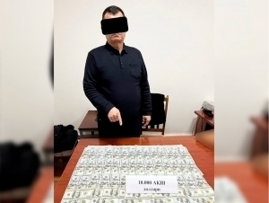 “Ўзйўлкўприк” мансабдори 10 минг доллар билан қўлга тушди (видео)
