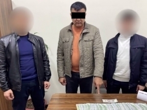 Soxta DXX xodimi 10 ming dollar bilan ushlandi