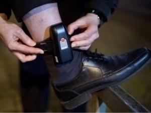 Individuals under house arrest are monitored by an electronic bracelet