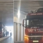 Truck loaded with cars gets stuck in tunnel